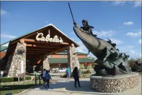  ?? BEN HASTY — MEDIANEWS GROUP ?? Each year, some 7million customers pass the sculpture “A leaf on a stream” by Vic Payne as they enter Cabela’s in Tilden Township.
