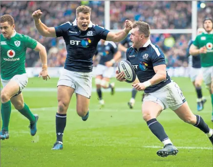 ??  ?? FLYING SCOT: Stuart Hogg powers over for Scotland’s second try of a glorious afternoon for Vern Cotter’s team
