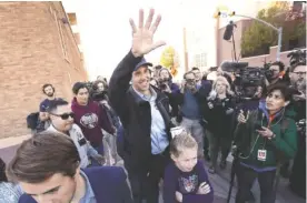  ?? AP PHOTO/ERIC GAY ?? Rep. Beto O’Rourke, the 2018 Democratic candidate for the Senate in Texas, waves to supporters as he leaves a polling place with his family after voting Tuesday.