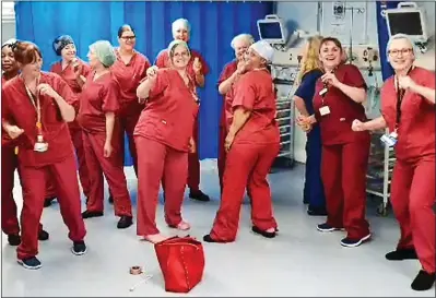 ??  ?? The theatre staff at Basildon Hospital in Essex dance to Olly Murs’s Dance With Me Tonight HAPPY FEET: