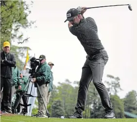  ?? ?? Canadian Corey Conners hits from the second cut of rough on the second hole during the first round of the Masters at Augusta National Golf Club on Thursday.