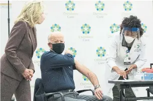  ?? CAROLYN KASTER THE ASSOCIATED PRESS FILE PHOTO ?? President Biden, seen getting his first dose of the coronaviru­s vaccine last month in Newark, Del., will have to roll up his sleeves again and work to restore his country’s lustre, Tony Burman writes.