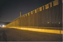  ?? RODRIGO ABD/ASSOCIATED PRESS FILE PHOTO ?? A portion of the new steel border fence stretches along the U.S.-Mexico border in Sunland Park. President Donald Trump will insist on the constructi­on of a wall across the southern border.