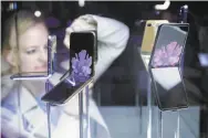  ??  ?? The Galaxy Z Flip phones are placed on display at the Samsung event held in in San Francisco