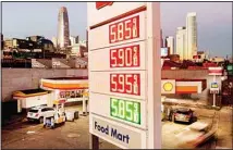  ?? ?? A marquee displays gas prices at a Shell station on Nov. 22, 2021, in San Francisco. Rising prices for oil and natural gas unsettled the global economic recovery in 2021. (AP)