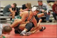  ?? SHARON HOLY — THE NEWS-HERALD ?? Dakota Ryan of Lake Catholic wrestles Ben Pacheco of Harvey during the Division II state duals subregiona­l on Jan. 24 at Perry.