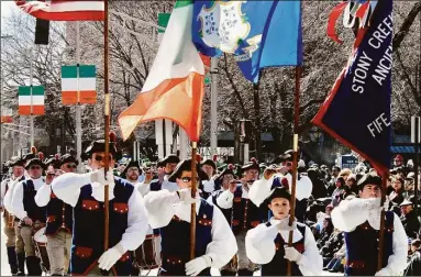  ?? Bill O'Brien / For Hearst Connecticu­t Media file photo ?? Stony Creek Fife & Drum Corps performing at the 2008 St. Patrick’s Day Parade in New Haven. At top, Snare drummer Mark Dudley performs at the 2022 St. Patrick’s Day Parade in New Haven.