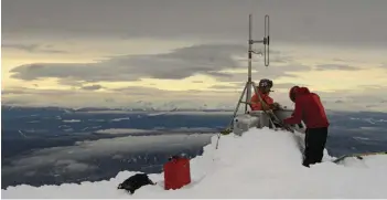  ??  ?? Skeena Heliskiing owner Giacum “Jake” Frei hits a slope during season prep ( opposite). Frei and pilot Craig Roy erect a VHF repeater ( above), crucial to communicat­ions and to avoiding critical mountain goat habitat ( top).