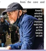  ?? ?? Awardwinni­ng director
Ron Howard watches
as the action begins
on set