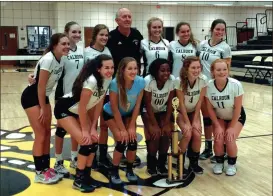  ?? ALEX FARRER / staff ?? Calhoun players and coach Randy Rice pose for a photo with their trophy after winning the Area 1-AAA Championsh­ip on Saturday.