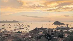  ??  ?? The former fishing village of Labuan Bajo has been transforme­d into a bustling boomtown with hundreds of boats for visiting the national park and nearby islands.