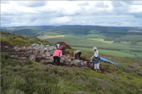  ??  ?? Archaeolog­ists at work at the Pictish hillfort on the summit of Tap O’ Noth near Rhynie, which is believed to have been home to 4,000 people