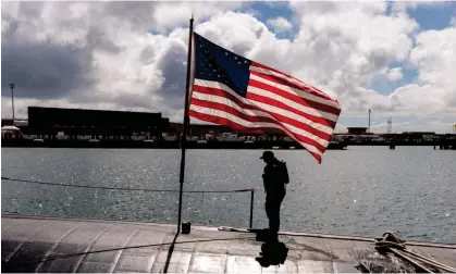  ?? Photograph: Richard Wainwright/AAP ?? A crew member is seen onboard the USS Asheville, a Los Angeles-class nuclear powered fast attack submarine, at HMAS Stirling in Perth. The US has passed a foreign military aid package that includes funding for Aukus.