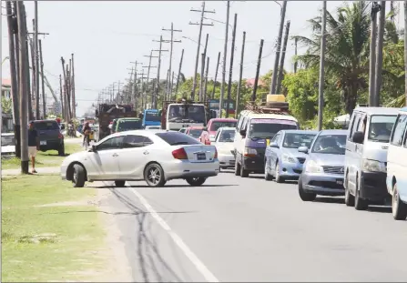  ??  ?? A seemingly endless line of traffic bracketed the Railway Embankment all day yesterday after th closed to facilitate culvert and road works. (Photo by Terrence Thompson)