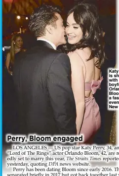  ??  ?? Katy Perry is shown with her boyfriend Orlando Bloom at a fashion event in New York.