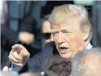  ?? CAROLYN KASTER/AP ?? President Donald Trump greets people after landing at Palm Beach Internatio­nal Airport.