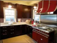  ??  ?? Julie Fryauf designed this Rogers kitchen (above and left) for Bryan Harvey, a pediatrici­an and hobbyist chef. It was important to Harvey for the space to be highly functional and appealing. Fryauf encourages her clients to invest in the spaces they...