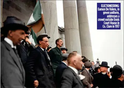  ??  ?? ELECTIONEE­RING: Eamon De Valera, in green uniform, addresses a crowd outside Ennis Court House in Co. Clare in 1917