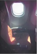  ?? MAX SEDDON/ THE ASSOCIATED PRESS ?? Light shines through a cabin window Monday on seat 17A, the seat that an Aeroflot official said was booked in the name of Edward Snowden, shortly before the flight from Moscow headed to Havana.