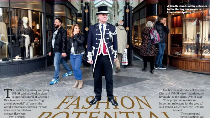  ?? Photo: CFP ?? A Beadle stands at the entrance to the Burlington arcade in London on April 27.