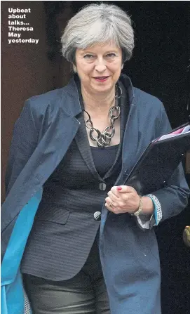  ?? Picture: MARY TURNER ?? Upbeat about talks... Theresa May yesterday