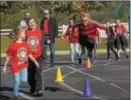  ??  ?? French Creek Elementary School fifthgrade student, Kaydence Van Guilder right does a jump during the walkathon.