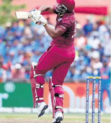  ??  ?? West Indies’ Kieron Pollard hit a six during the first Twenty20 internatio­nal cricket match against India, yesterday, in Lauderhill, Florida. Pollard top-scored 49 as the West Indies lost by four wickets.