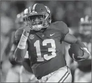  ?? AP Photo/Gerald Herbert ?? Alabama quarterbac­k Tua Tagovailoa (13) scores on a 44-yard touchdown carry in the second half against LSU in Baton Rouge, La., on Saturday. Top-ranked Alabama defeated LSU 29-0. LSU fell from No. 4 to No. 9 in the latest AP college football poll.