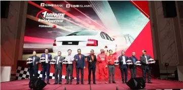  ??  ?? CIMB Group CEO Tengku Datuk Seri Zafrul Aziz, Gupta (fifth left), with the management and sales representa­tives UMW Toyota Motor Sdn Bhd, Ingress Auto Malaysia Sdn Bhd, Honda Malaysia Sdn Bhd, Cycle & Carriage Bintang Bhd, Edaran Tan Chong Motor Sdn...