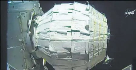  ?? NASA VIA AP ?? An image from video provided by NASA shows the inflation of a new experiment­al room Saturday at the Internatio­nal Space Station. Saturday was NASA’s second shot at inflating the Bigelow Expandable Activity Module, named for the aerospace company that...
