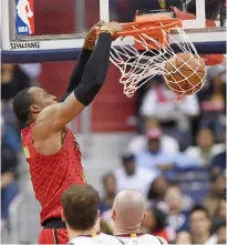  ?? (Photo by Nick Wass, AP) ?? Atlanta Hawks center Dwight Howard dunks against the Washington Wizards during the first half of Wednesday’s game.