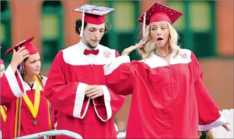  ?? SEAN D. ELLIOT/THE DAY ?? Graduate Morgan Langley executes a dramatic hair flip as she takes the stage to accept her diploma during commenceme­nt exercises for the Norwich Free Academy Class of 2018 on Thursday. Visit www.theday.com for a list of graduates and a photo gallery from the ceremony.