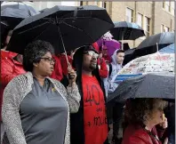 ?? Arkansas Democrat-Gazette/DALE ELLIS ?? Stacey and LaRon McAdoo, teachers at Little Rock Central High School, stand with more than 250 educators, students and parents Wednesday as part of a districtwi­de “walk-in” protest to show solidarity.