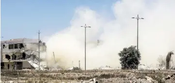  ??  ?? Smoke rising in the aftermath of the Syrian government forces’ demolition of a tunnel formerly used by rebels in the capital Damascus’ northeaste­rn suburb of Qaboun. — AFP photo