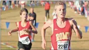  ?? Tommy Romanach / RN-T ?? Rome High’s Sam Pierce (right) races ahead of teammate Patrick Motes as they come into the finish of the Class 5A state championsh­ip boys’ race Friday in Carrollton.