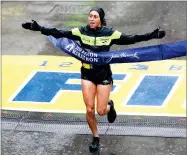  ?? AP PHOTO BY CHARLES KRUPA ?? Desiree Linden, of Washington, Mich., wins the women's division of the 122nd Boston Marathon on Monday, April 16, in Boston.