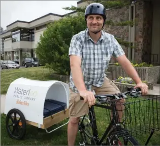  ?? VANESSA TIGNANELLI, RECORD STAFF ?? Jaymis Goertz rides Waterloo Public Library’s maker bike to community events around the city.