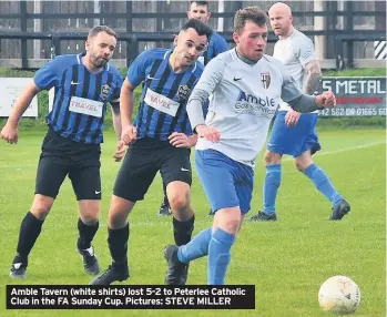  ??  ?? Amble Tavern (white shirts) lost 5-2 to Peterlee Catholic Club in the FA Sunday Cup. Pictures: STEVE MILLER