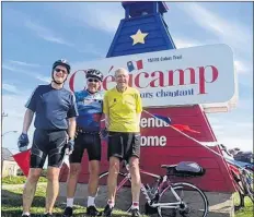 ?? CONTRIBUTE­D ?? From left, Patrick Murphy, a first-time Cabot Trail cyclist from Sydney, columnist Paul MacDougall and Derek Watts of Wolfville, take a break in Cheticamp.