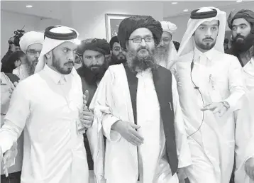  ?? GIUSEPPE CACACE /AFP 2020 ?? Mullah Abdul Ghani Baradar, center, is co-founder of the Taliban and the group’s deputy leader.