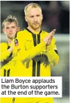  ??  ?? Liam Boyce applauds the Burton supporters at the end of the game.