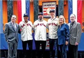  ?? HANS PENNINK/THE ASSOCIATED PRESS ?? From left, Hall of Fame President Josh Rawitch with newly-elected Baseball Hall of Fame inductees Adrián Beltré, Todd Helton and Joe Mauer; Chairman of the Board Jane Forbes Clark and BBWAA secretary-treasurer Jack O’Connel pose Thursday during a news conference in Cooperstow­n, N.Y.