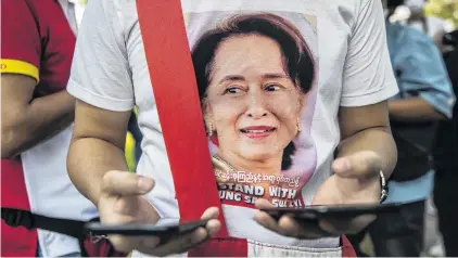  ?? PHOTO: GETTY IMAGES ?? A Myanmar anticoup protester wears an Aung San Suu Kyi shirt at a rally in front of the UN building in Bangkok last week.