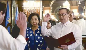  ??  ?? President Duterte swears in new Foreign Affairs Secretary Teodoro Locsin Jr. at Malacañang on Wednesday. Also in photo is Locsin’s wife Louie.