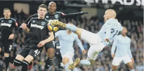  ?? PICTURE: CLIVE BRUNSKILL/ GETTY ?? David Silva scores league leaders Manchester City’s late winner against West Ham.