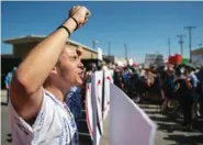  ?? ROBERTO E. ROSALES/THE ALBUQUERQU­E JOURNAL VIA AP ?? Protesters chant and block the vehicle entrance Tuesday at Border Patrol headquarte­rs in El Paso, Texas. The protest drew several hundred marchers opposed to the separation of minors from their parents.