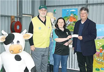  ??  ?? Presenting funds to the Warragul Hub are (from left): Warragul and Drouin Neighbourh­ood Watch area manager Mick Royce, Warragul Hub centre manager Julie Bellingham and NHW secretary David Piggin.