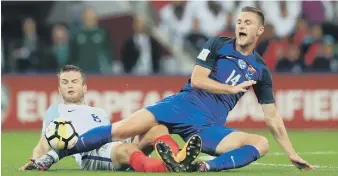  ??  ?? Slovakia’s Milan Skriniar is challenged by England’s Eric Dier.