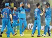  ?? AFP ?? Indian players celebrate a New Zealand wicket.