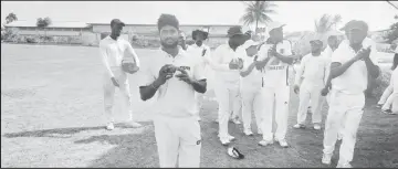  ?? ?? Totaram Bishun is applauded by his teammates after his 6/22 bundled out Transport for just 80 in their second inning